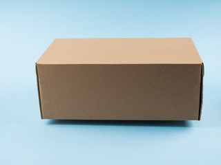 Contactless delivery concept. Cardboard box in levitation