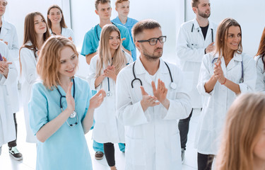 large group of young doctors showing thumbs up