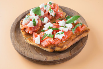 Italian bruschetta with tomatoes, mozzarella cheese and basil