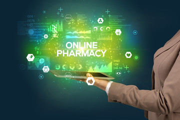 Fototapeta premium Close-up of a touchscreen with ONLINE PHARMACY inscription, medical concept