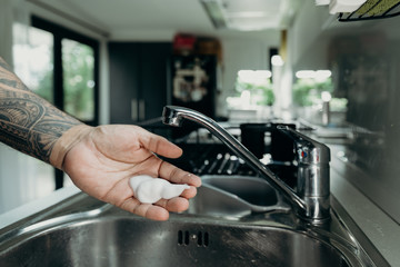 A man washing his hands with foam hand wahs for corona virus prevention, hygiene to stop spreading coronavirus.