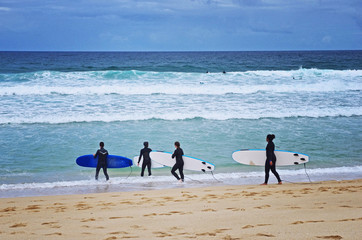 Beginner surfers on the beach. Surfing lesson. Love surfing. Surf school.