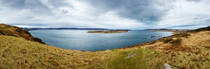 Fototapeta na wymiar Beautiful panorama of a lake on a cloudy day in Highlands, Scotland