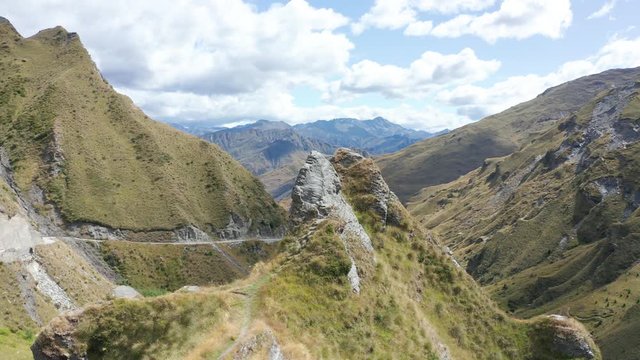 Extremely dangerous road in Skippers Canyon with mountains and valleys, New Zealand
