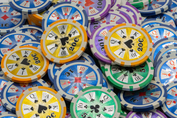 Close overhead view of a mountain of poker chips