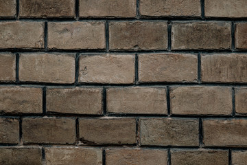 background of old authentic brick wall at Chernivtsi University. Handmade brick textured unique colors, the work of true craftsmen