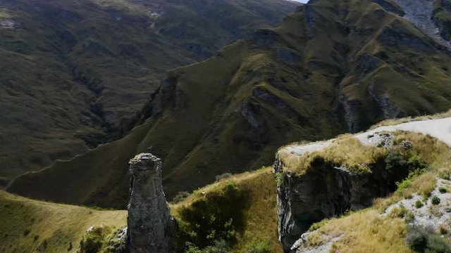 Extremely dangerous road in Skippers Canyon with mountains and valleys, New Zealand