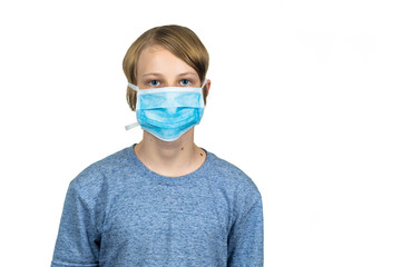 Young teenage boy wearing a protective mask. Isolated on white.