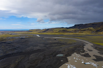 Aerial photograph of an Icelandic Glacier with moody clouds