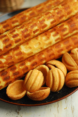 Delicious homemade wafer rolls filled with condensed milk and fried walnuts