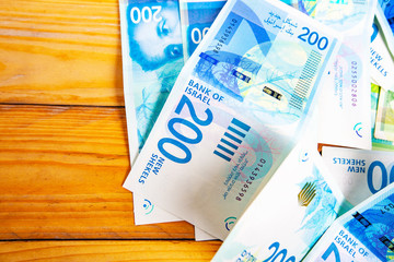 Israely Shekel money bills collection background.