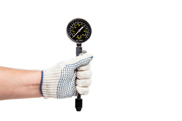 Professional instrument for measuring engine compression in the hand, close-up, white isolated background.