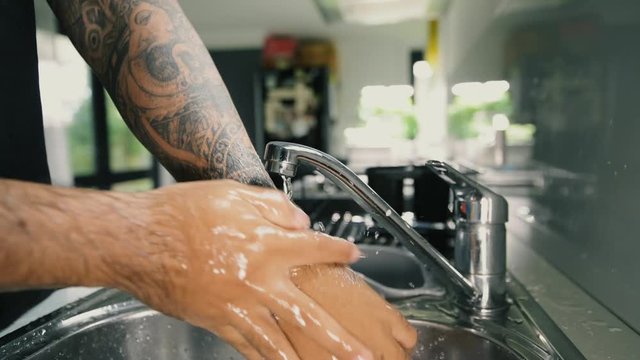 A man washing his hands with foam hand wahs for corona virus prevention, hygiene to stop spreading coronavirus.
