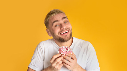 Sweet tooth man happy eat donut, panorama