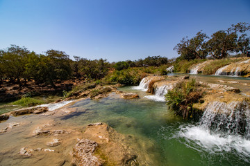 Fototapeta na wymiar River Waterfall and pond in Wadi Darbat near Salalah