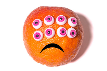 orange fruit with plastic toys eyes