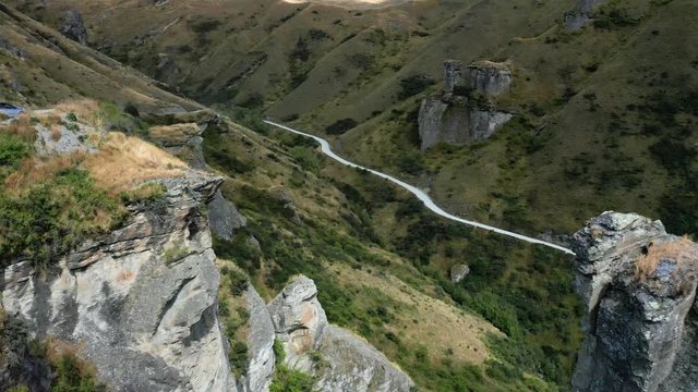 Extremely dangerous road in Skippers Canyon with mountains and valleys, New Zealand