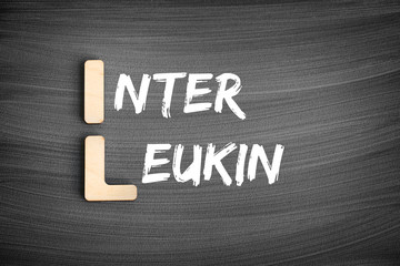 IL - interleukin acronym, medical concept on blackboard