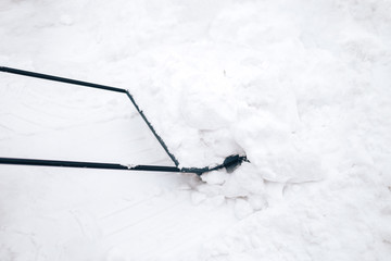 Snow removal by hand with a shovel Snow removal after heavy snowfall