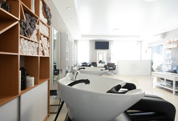 Fototapeta na wymiar Wash sink in interior of hairdressing salon