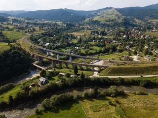 Fototapeta na wymiar Aerial old viaduct railway crossing in Vorokhta Ukraine Carpathians