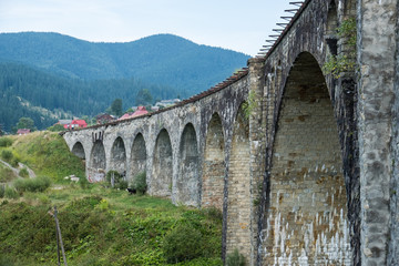 Fototapeta na wymiar old viaduct railway crossing in Vorokhta Ukraine Carpathians