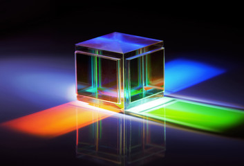 a glass cube reflects many colors