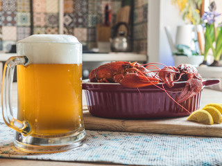 Crawfish. Boiled red crayfish or crawfish with a beer and lemon on the kitchen table.