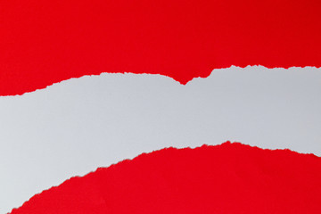 Red torn paper with white copy space.