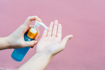 Hands using alcohol gel as hand sanitizer for prevent the spread of germs and bacteria and avoid infections corona virus. Hygiene concept