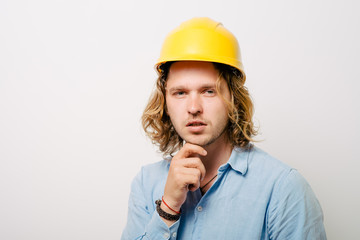 Working man thinking on a gray background