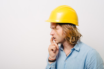 Working man thinking on a gray background