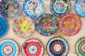 Close-up view of colorful Turkish plates displayed at an outdoor souvenir stand in Istanbul, Turkey