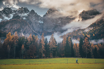 Sport photo, active life in outdoor. Man train in autumn mountains. Alps, Italy