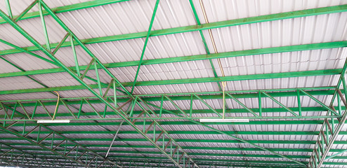 Green metal roof structure for the garage.