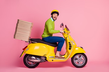 Fototapeta na wymiar Profile side view of his he nice attractive crazy overjoyed cheerful cheery guy driving moped bringing pile stack pizza order punctuality isolated over pink pastel color background