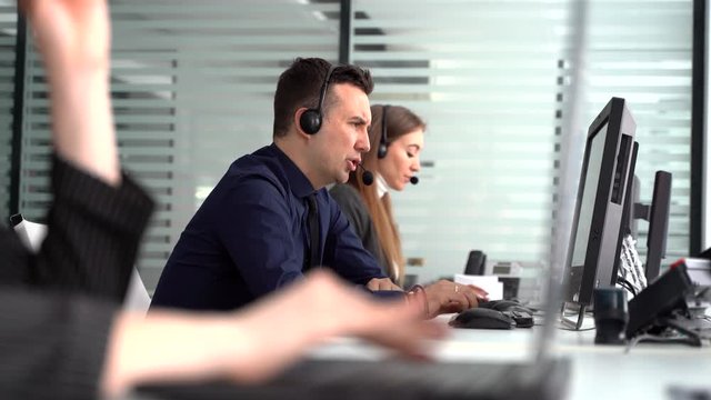 A call center employee accompanied by their team. customer support operator at work
