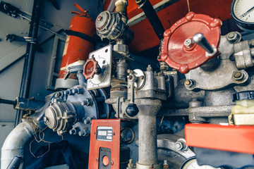 Fire truck equipment, red knobs and valves, close up