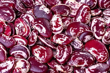 Beautiful multicolored beans close-up on a concrete background