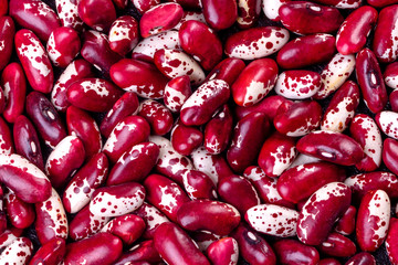 Beautiful multicolored beans close-up on a concrete background