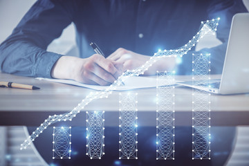 Double exposure hands with stock market chart.