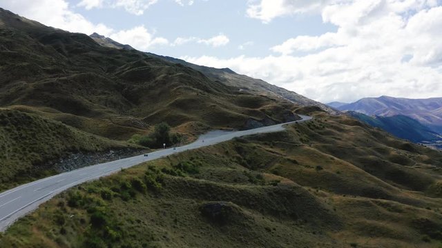 Aerial video of Winding road towards The Coronet Peak and Skippers Road Entrance and Arrowtown in the background. Otago, New Zealand