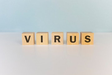 The word Virus on wooden cubes. Medical concept.