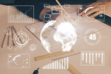Double exposure of man's hands writing notes of stock market with forex chart.