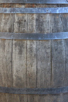 A Close Up Photograph Of The Side Of A Barrel.  Old Wood And Metalwork Texture, Industrial Concept.