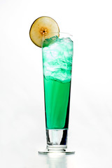 Green cocktail in a tall glass with ice cubes isolated on white