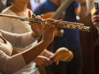 Flute in hands of a woman in cuba