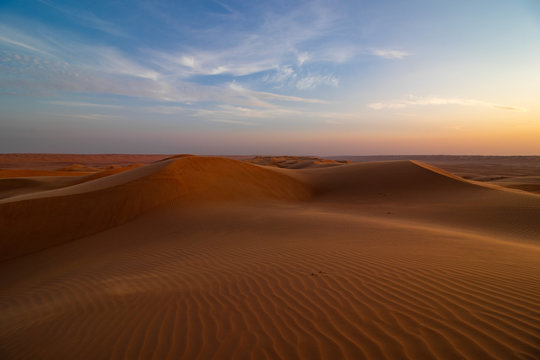 Sunset on sand dune in Wahiba sands desert near Bidiyya in Oman © Stefan