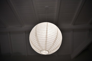 paper round lamp on a gray background