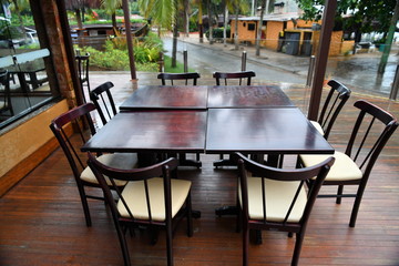 table with chairs on the veranda against the rain